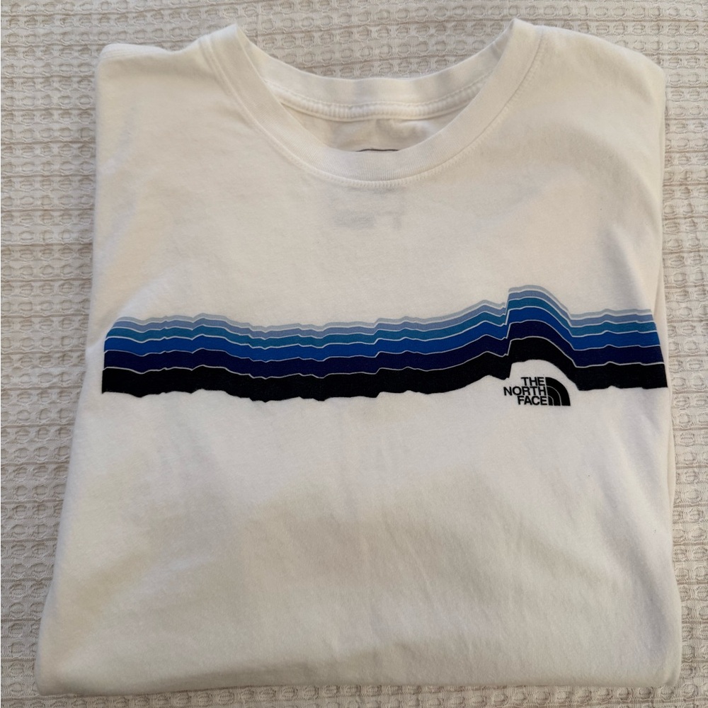 The North Face White Tee with Blue and Black Wave Design